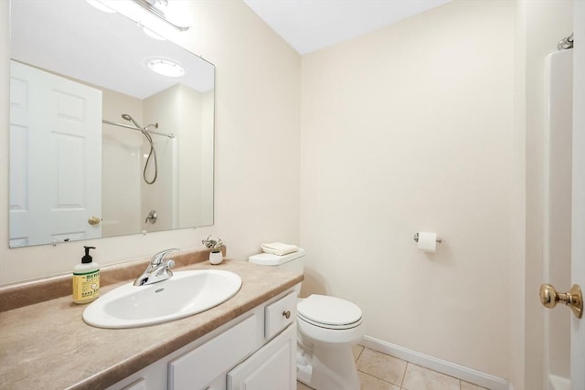 bathroom featuring tile patterned floors, toilet, baseboards, walk in shower, and vanity