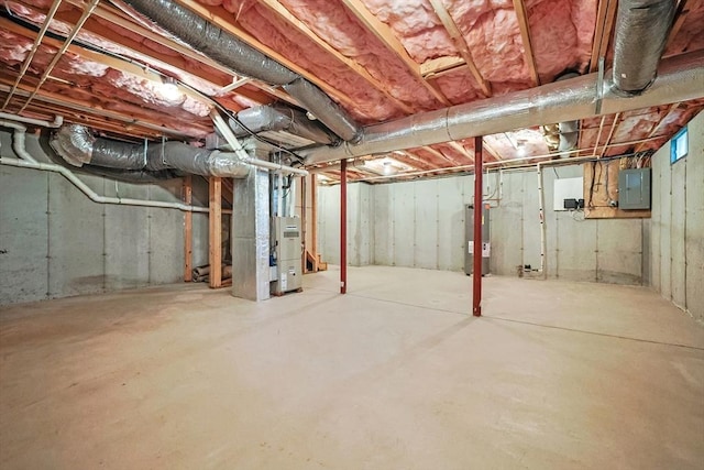 unfinished basement with electric panel, heating unit, and water heater