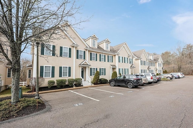 exterior space featuring a residential view and uncovered parking