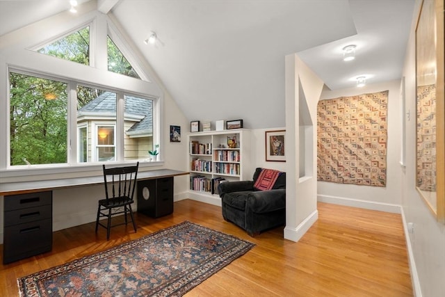 office space with light wood-style flooring and baseboards