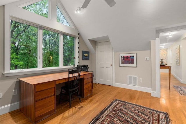 office with lofted ceiling, baseboards, light wood-type flooring, and a ceiling fan