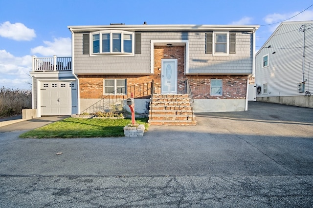 view of front facade with a balcony and a garage