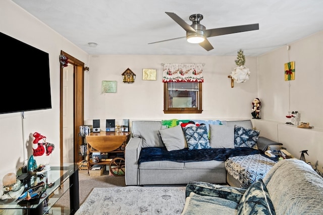 living room featuring carpet flooring and ceiling fan