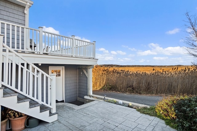 view of patio featuring a balcony