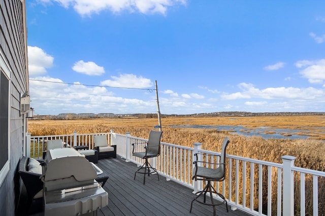 wooden deck featuring a rural view