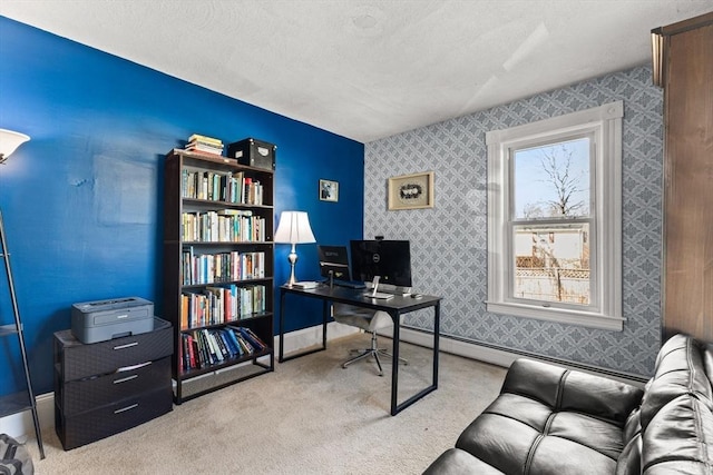 office space featuring a baseboard heating unit, a textured ceiling, carpet floors, wallpapered walls, and baseboards