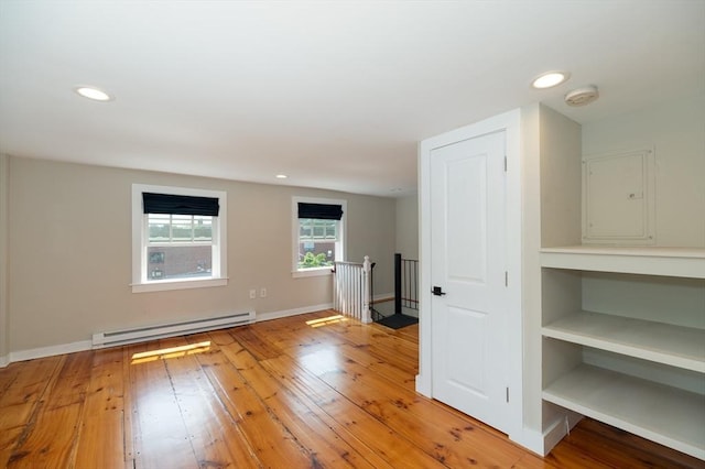 2 Court St Unit 3, Newburyport, MA 01950 - empty room featuring baseboard heating, a smoke detector, electric panel, recessed lighting, and light wood-style floors