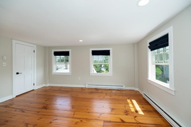2 Court St Unit 3, Newburyport, MA 01950 - empty room featuring a baseboard heating unit, wood-type flooring, and recessed lighting