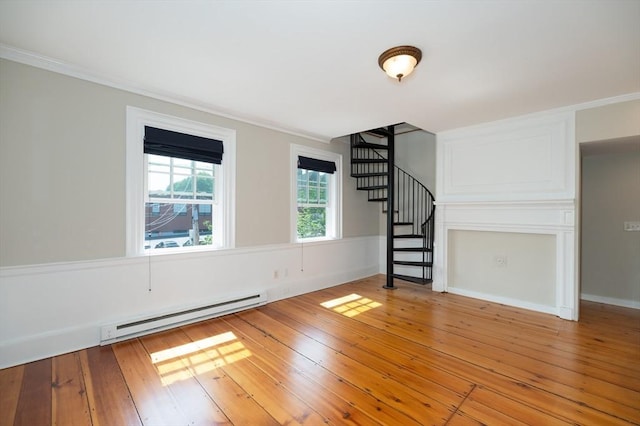 2 Court St Unit 3, Newburyport, MA 01950 - unfurnished living room featuring a baseboard radiator, stairs, light wood finished floors, and crown molding