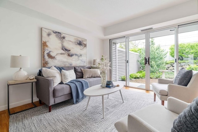 living room featuring wood finished floors and baseboards