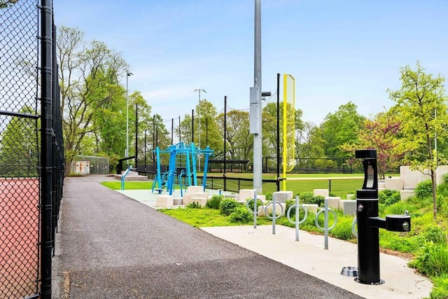 view of community featuring fence