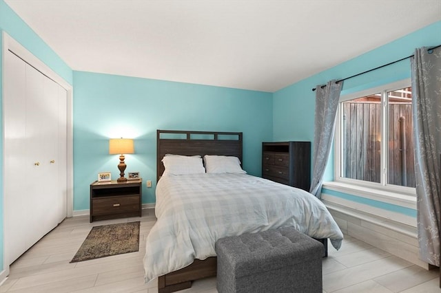 bedroom featuring light hardwood / wood-style flooring and a closet