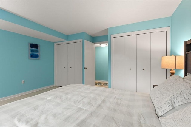 bedroom with multiple closets