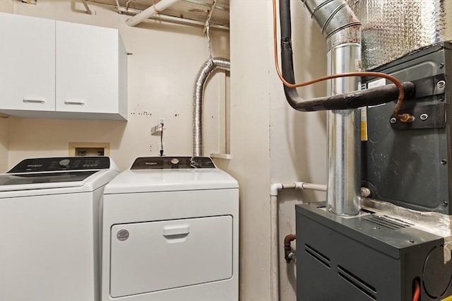 clothes washing area with independent washer and dryer