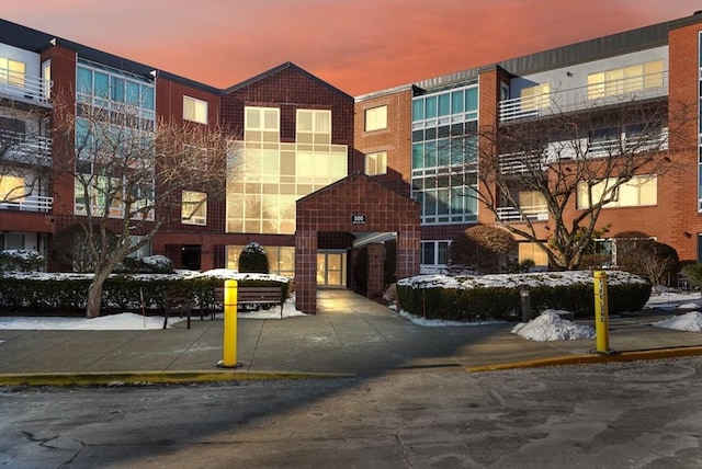 view of outdoor building at dusk