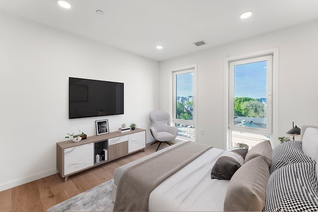 bedroom with hardwood / wood-style flooring