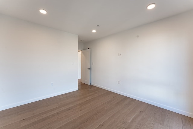 spare room with light wood-type flooring