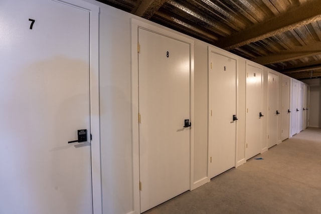 hall with beamed ceiling and wood ceiling