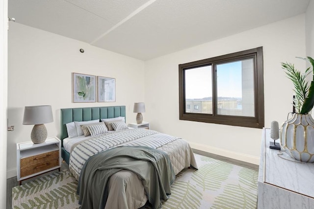 bedroom with hardwood / wood-style floors