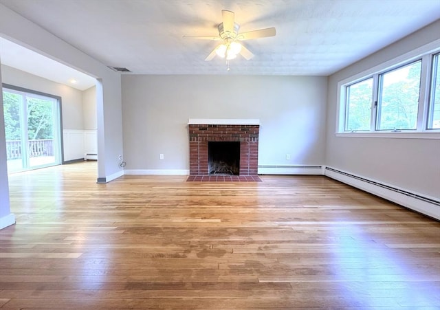 6 Oak St, Foxboro, MA 02035 - unfurnished living room with ceiling fan, a baseboard radiator, light wood-type flooring, and a fireplace