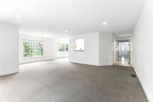 102 Pinehurst Dr Unit 102, East Longmeadow, MA 01028 - unfurnished living room with carpet, baseboards, visible vents, and recessed lighting