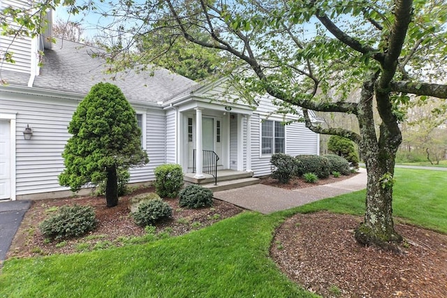 102 Pinehurst Dr Unit 102, East Longmeadow, MA 01028 - view of front of property with a front lawn and a shingled roof