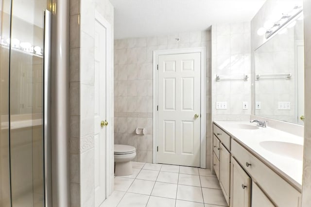 102 Pinehurst Dr Unit 102, East Longmeadow, MA 01028 - full bath featuring a sink, tile patterned flooring, tile walls, and toilet