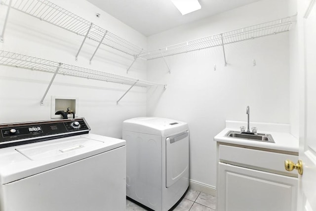 102 Pinehurst Dr Unit 102, East Longmeadow, MA 01028 - laundry area featuring light tile patterned floors, a sink, washer and dryer, and cabinet space
