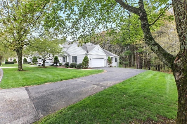102 Pinehurst Dr Unit 102, East Longmeadow, MA 01028 - view of property exterior with a yard, aphalt driveway, and an attached garage
