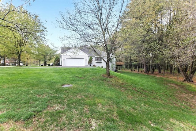 102 Pinehurst Dr Unit 102, East Longmeadow, MA 01028 - view of yard featuring a garage