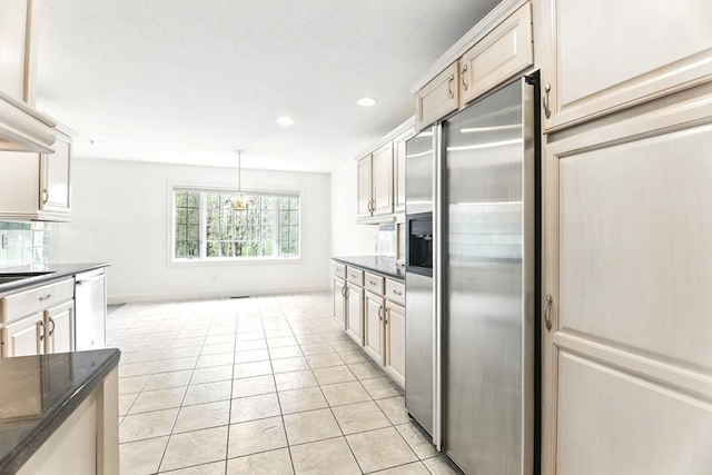 102 Pinehurst Dr Unit 102, East Longmeadow, MA 01028 - kitchen with light tile patterned floors, dark countertops, stainless steel appliances, and recessed lighting