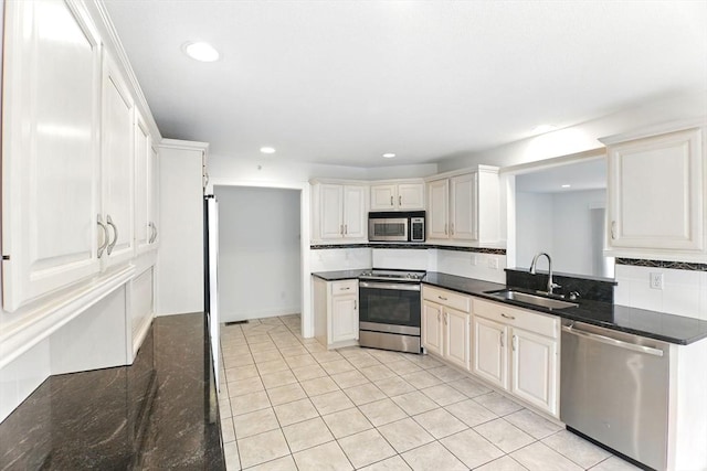 102 Pinehurst Dr Unit 102, East Longmeadow, MA 01028 - kitchen with a sink, tasteful backsplash, recessed lighting, light tile patterned floors, and appliances with stainless steel finishes