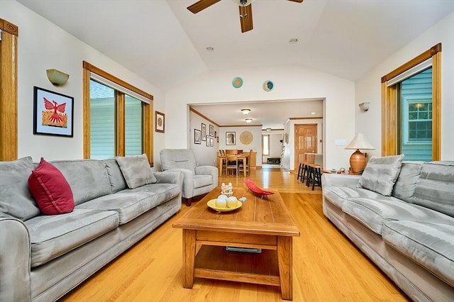 living area featuring light wood-style flooring, ceiling fan, and lofted ceiling