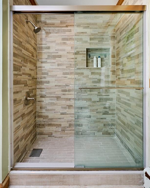 bathroom featuring a stall shower