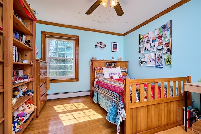 bedroom with wood finished floors, crown molding, a baseboard heating unit, and ceiling fan