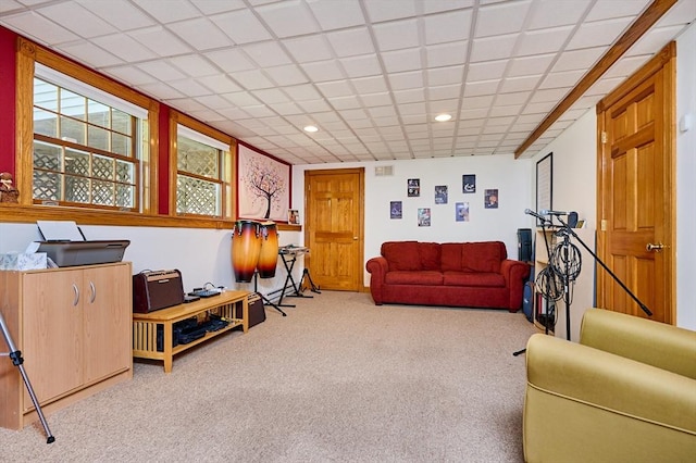 carpeted living room with recessed lighting