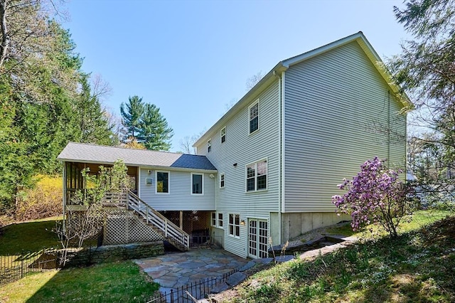 back of house with fence, stairs, and a patio area