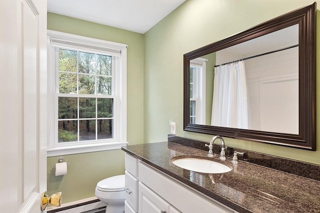 full bath featuring toilet, curtained shower, vanity, and a baseboard heating unit