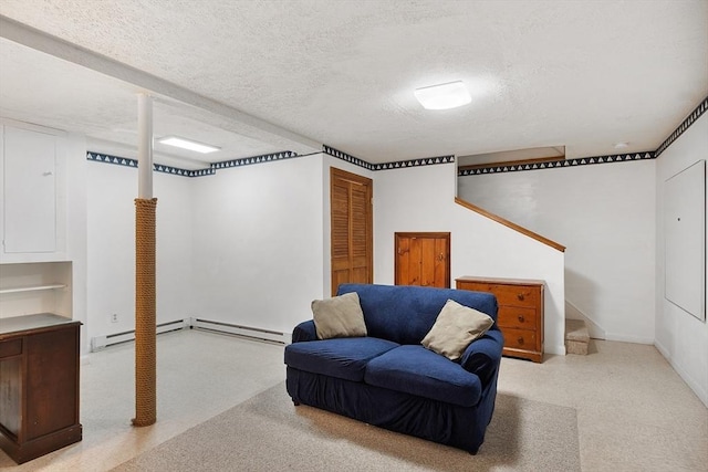 sitting room featuring a textured ceiling, stairway, and baseboards
