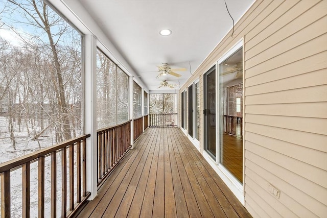 snow covered deck featuring ceiling fan