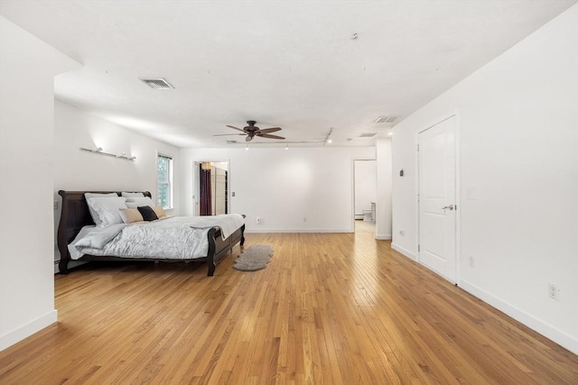 bedroom featuring ceiling fan and light hardwood / wood-style floors