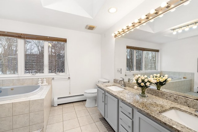 bathroom featuring a baseboard radiator, tile patterned floors, tiled bath, toilet, and vanity