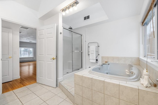 bathroom featuring tile patterned floors and plus walk in shower