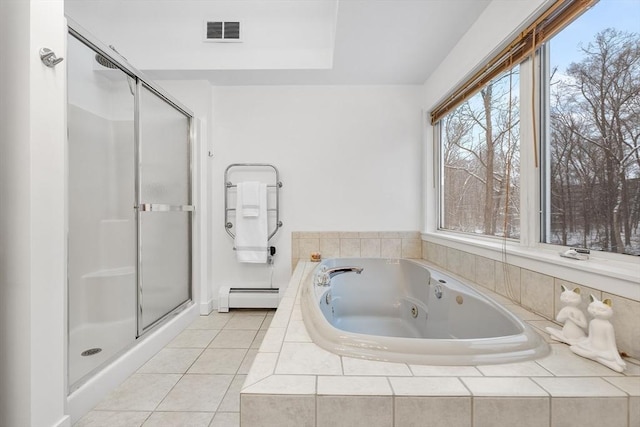 bathroom featuring tile patterned flooring, plenty of natural light, tiled bath, and a baseboard heating unit