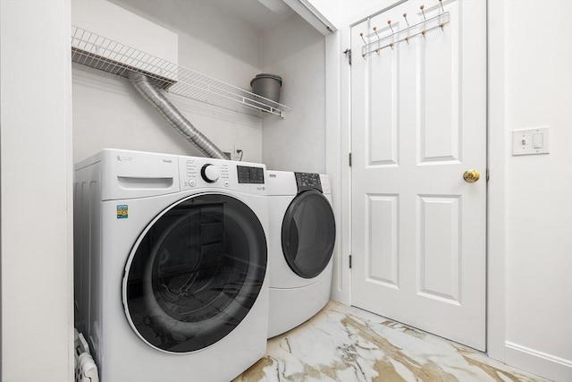 clothes washing area featuring washing machine and dryer