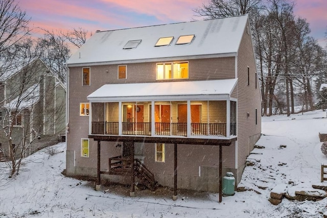 view of snow covered house