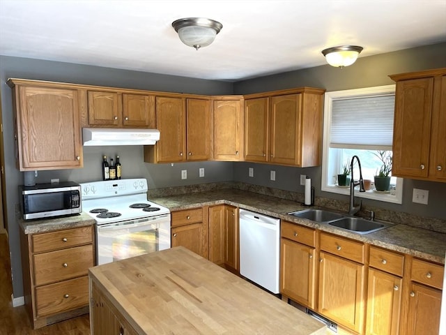 kitchen featuring wood counters, sink, white appliances, and light hardwood / wood-style floors