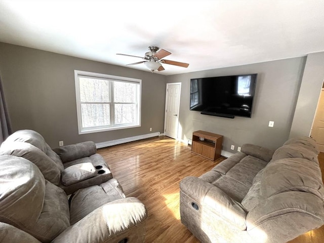 living room with ceiling fan, a baseboard radiator, and light hardwood / wood-style floors