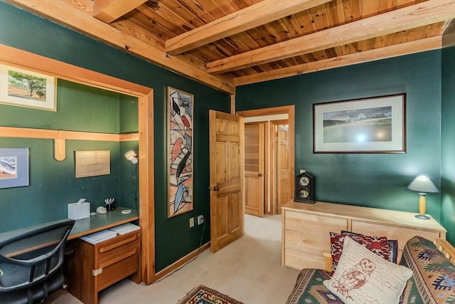 office featuring beamed ceiling, wooden ceiling, and light carpet