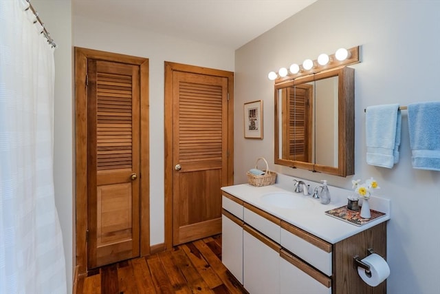 bathroom featuring vanity and hardwood / wood-style flooring